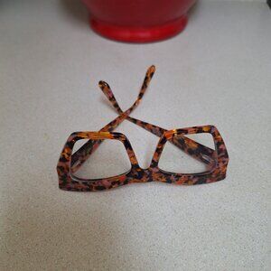 WOMAN READING GLASSES.